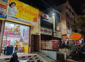 Softcare Industries storefront at night
